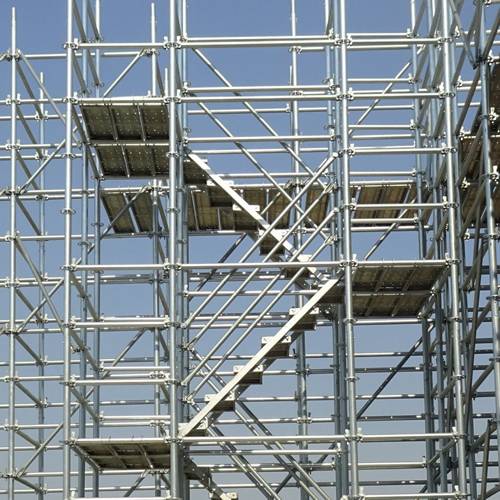 An erected ringlock scaffolding system is displayed against the blue sky.