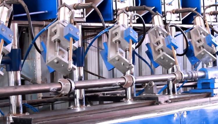 A welding machine is welding the lower cup to the cuplock scaffold standard.